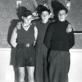 Three unknown boys indoors.jpg